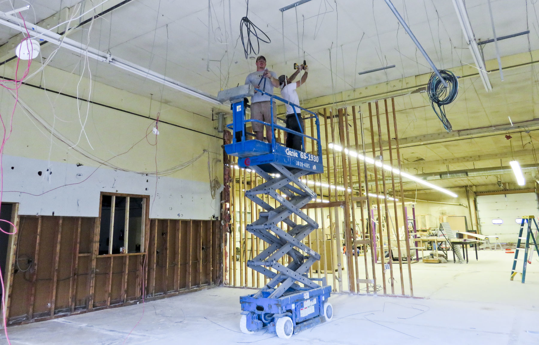 Contractors work on renovating the old Helena Industries building into the new Helena Avenue Theatre.